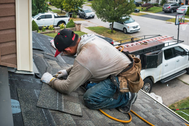 Professional Roof Replacement technician working in Donahue, IA